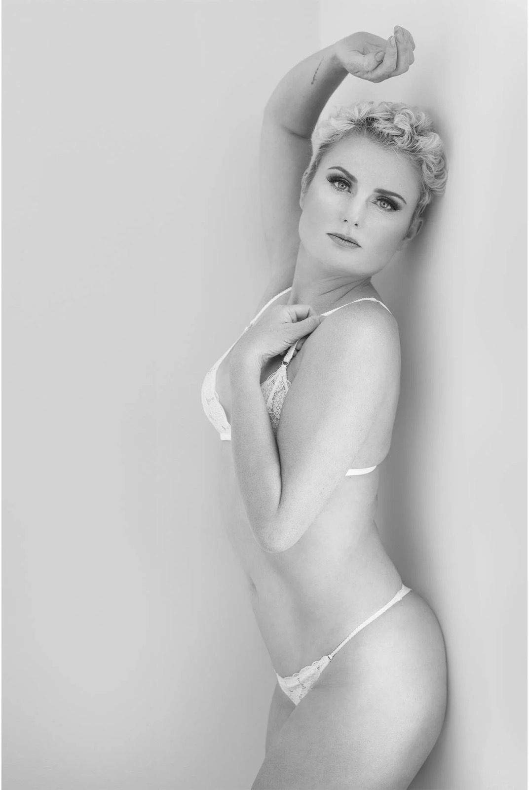 Glamour boudoir portrait with soft studio lighting