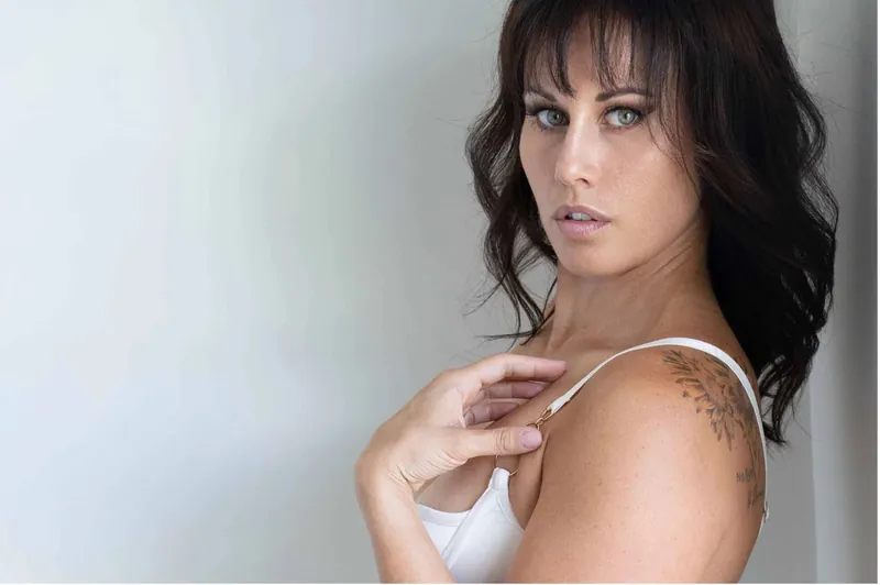 Soft colour boudoir portrait with relaxed eye contact